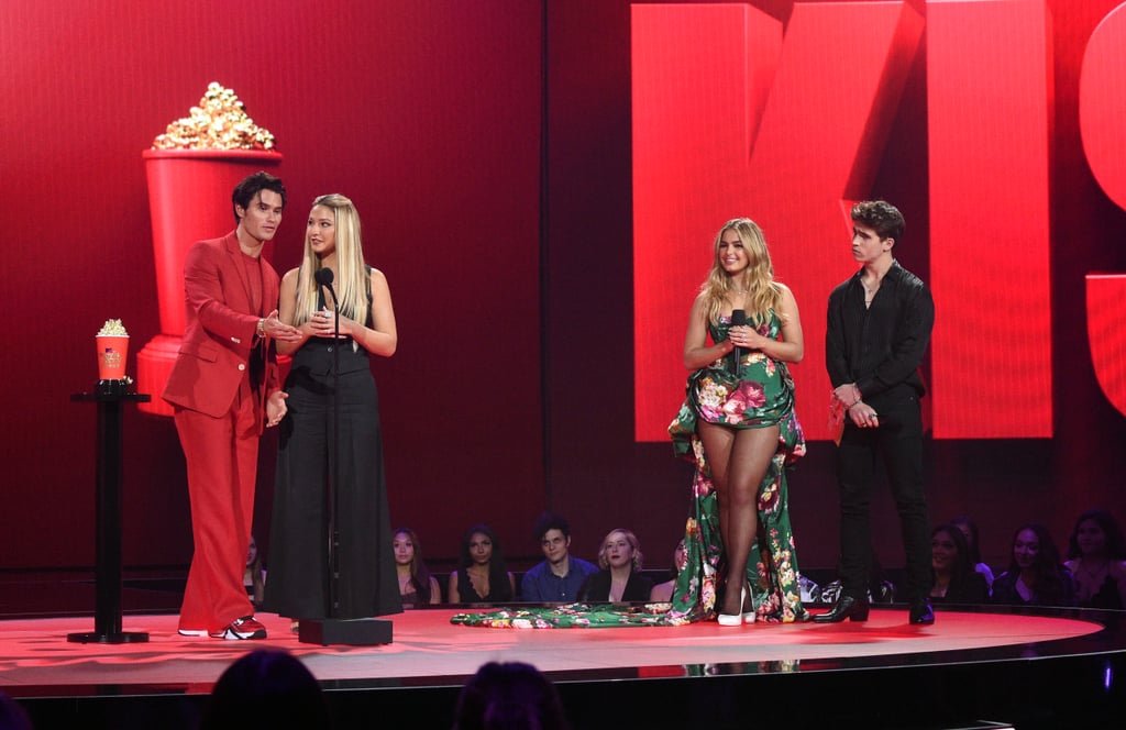 Madelyn Cline Wearing a Black Pantsuit Onstage With Chase Stokes