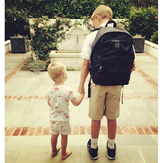 When big brother goes back to school, little brother gets to wait for the bus with him. So cute!