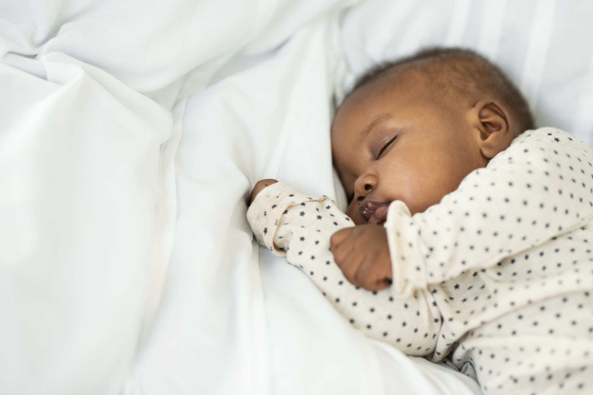 Cropped shot of a baby girl sleeping peacefully at home