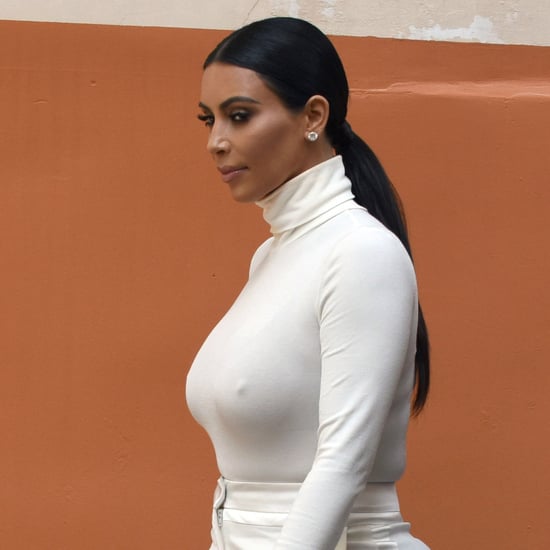 Kim Kardashian With Cutout of Rob Kardashian's Face