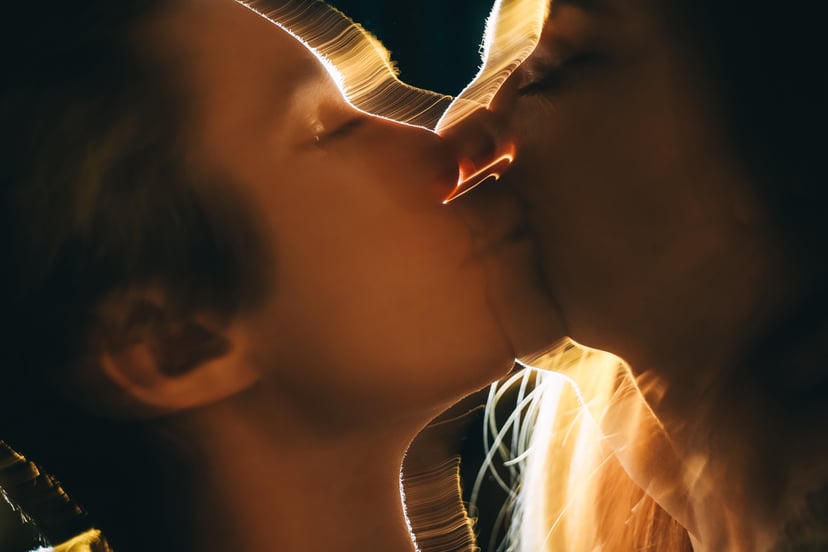 Blurry photo of a couple passionately kissing