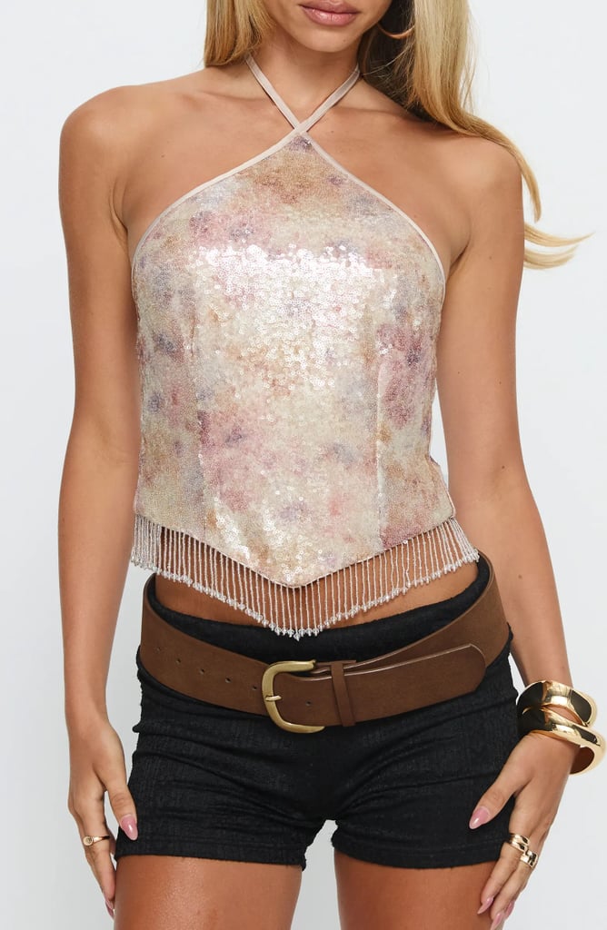 Princess Polly Udelle Sequin Fringe Halter Crop Top ($59)
Nothing says disco like a halter top, and this one comes with fringe details that take it to the next level. Roll on a touch of body glitter (like this one) for that extra sparkle — because if you're going to shine, why not go all in?