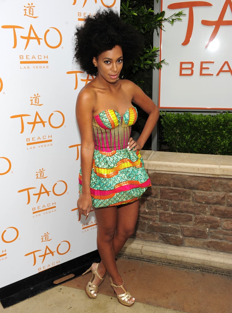 Solange lit up TAO Beach in a high-wattage mini by Boxing Kitten and gold metallic YSL sandals in 2010.