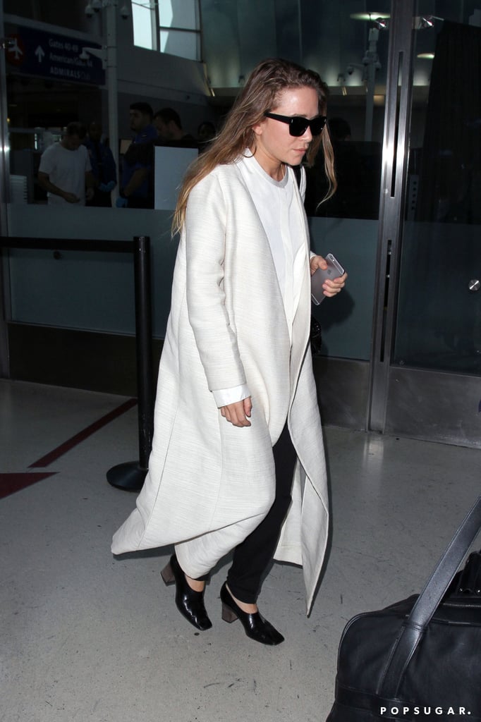 Mary-Kate Olsen Wearing a White Coat at the Airport