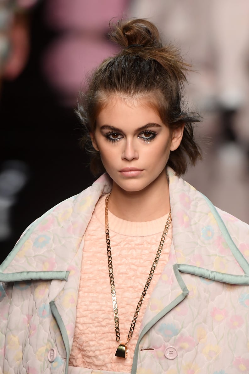 Kaia Gerber's Messy Topknot and Dark Eyeliner