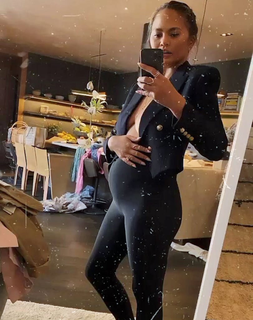 Chrissy Teigen Shows Her Baby Bump in Leggings and a Blazer