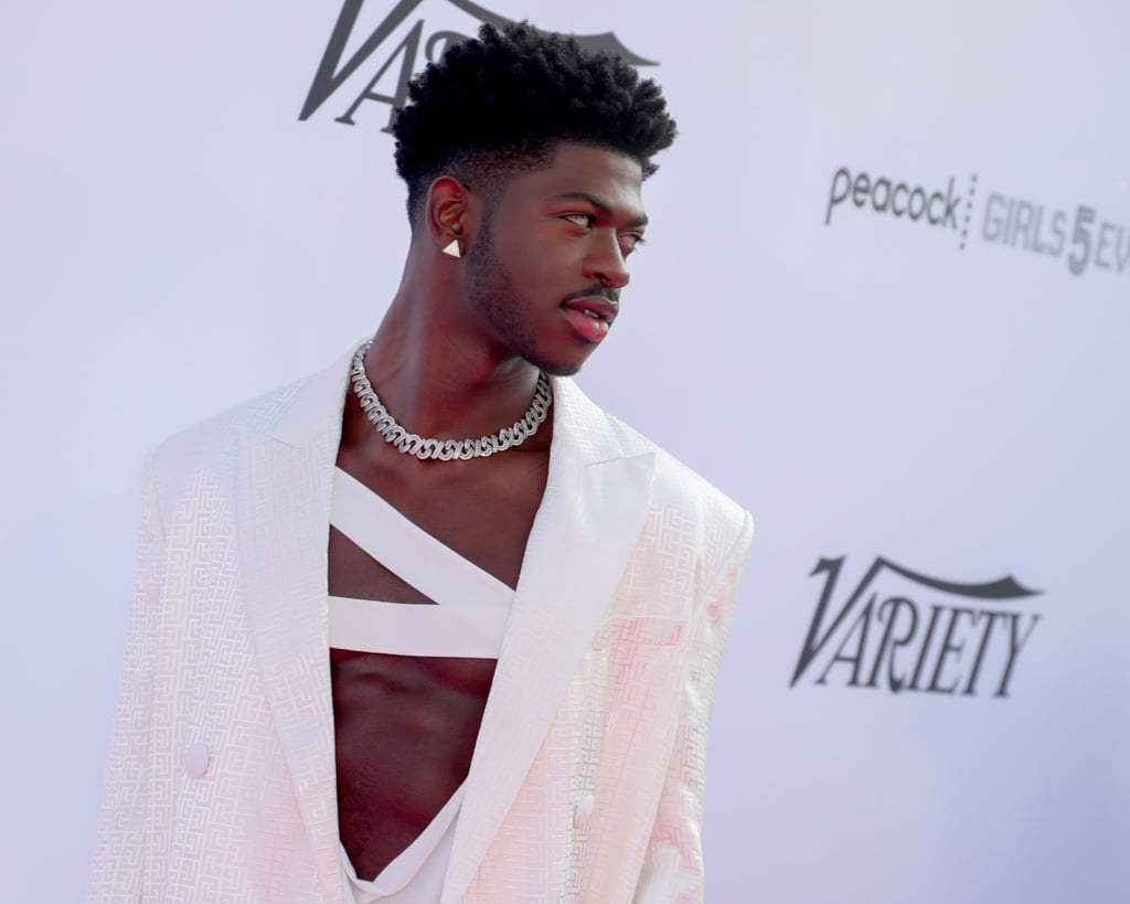 Lil Nas X Wears a White Balmain Pantsuit and Bandage Top