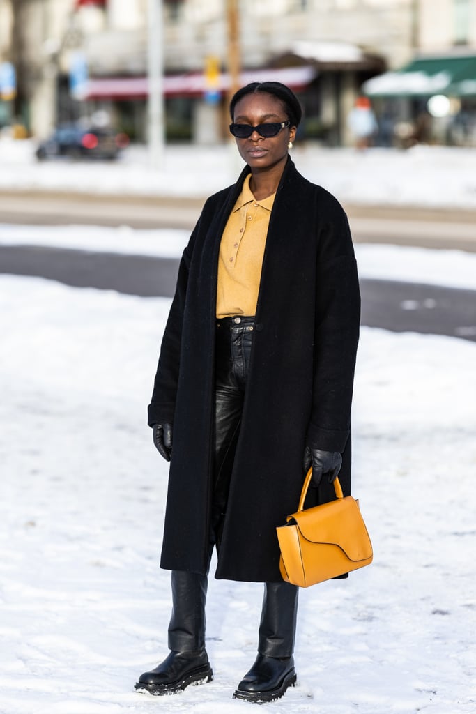 Accent an all-black outfit with a bright bag and a matching shirt in a more muted tone.
