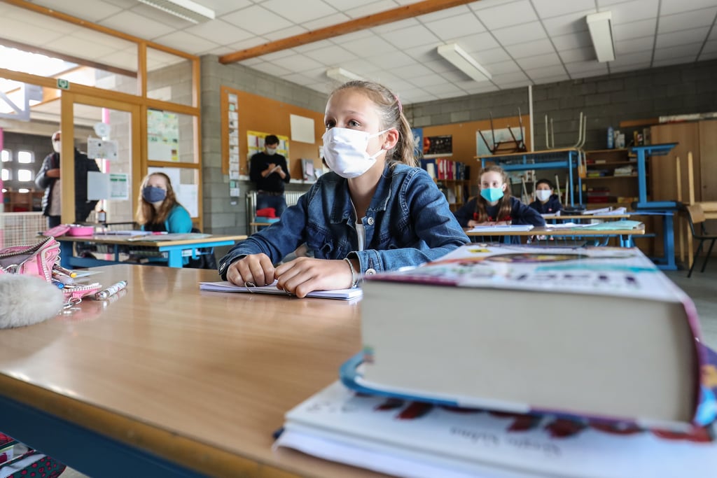 A photographer captured what it was like for kids to return to school in Belgium amid the coronavirus pandemic. Clad in masks, students were able to attend in-person learning in May.