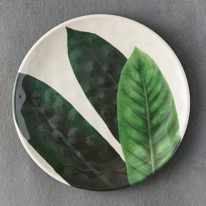 The modern illustration on this Tropical Foliage Melamine Plate ($12) is attention-getting.