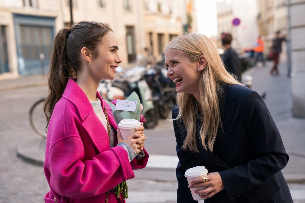 Wearing a bright pink peacoat.