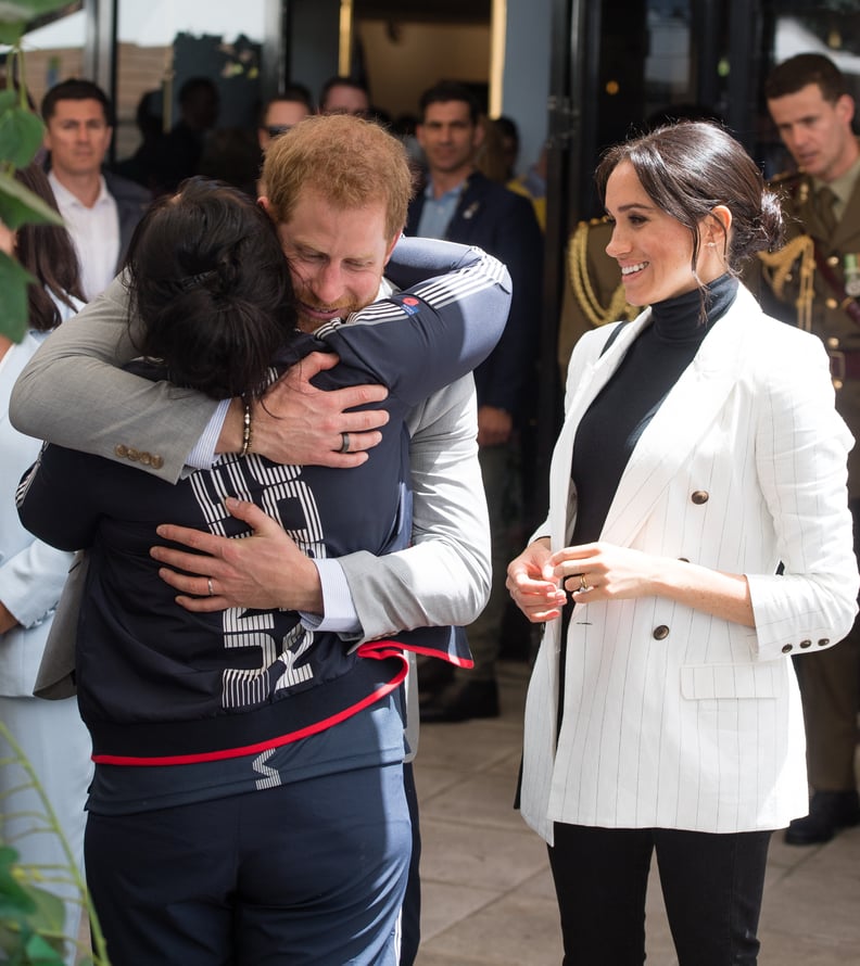 Harry hugged a UK competitor during a reception held by the Prime Minister of Australia in 2018.