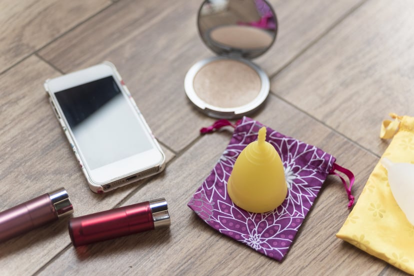 Menstrual cup, mobile and some beauty stuff, everything what a modern girl or woman needs for her period.