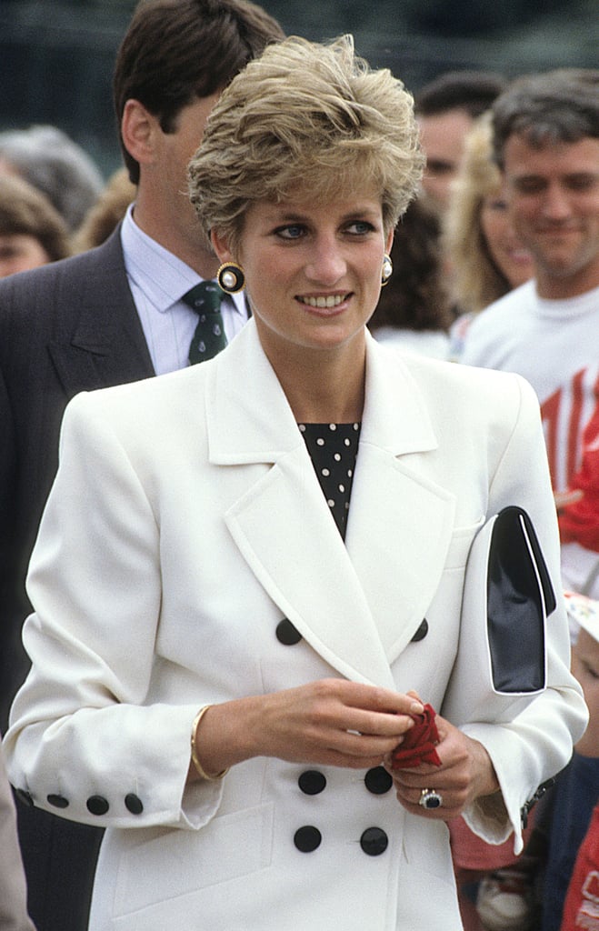 She flashed her signature smile during a tennis match in England in July 1991.