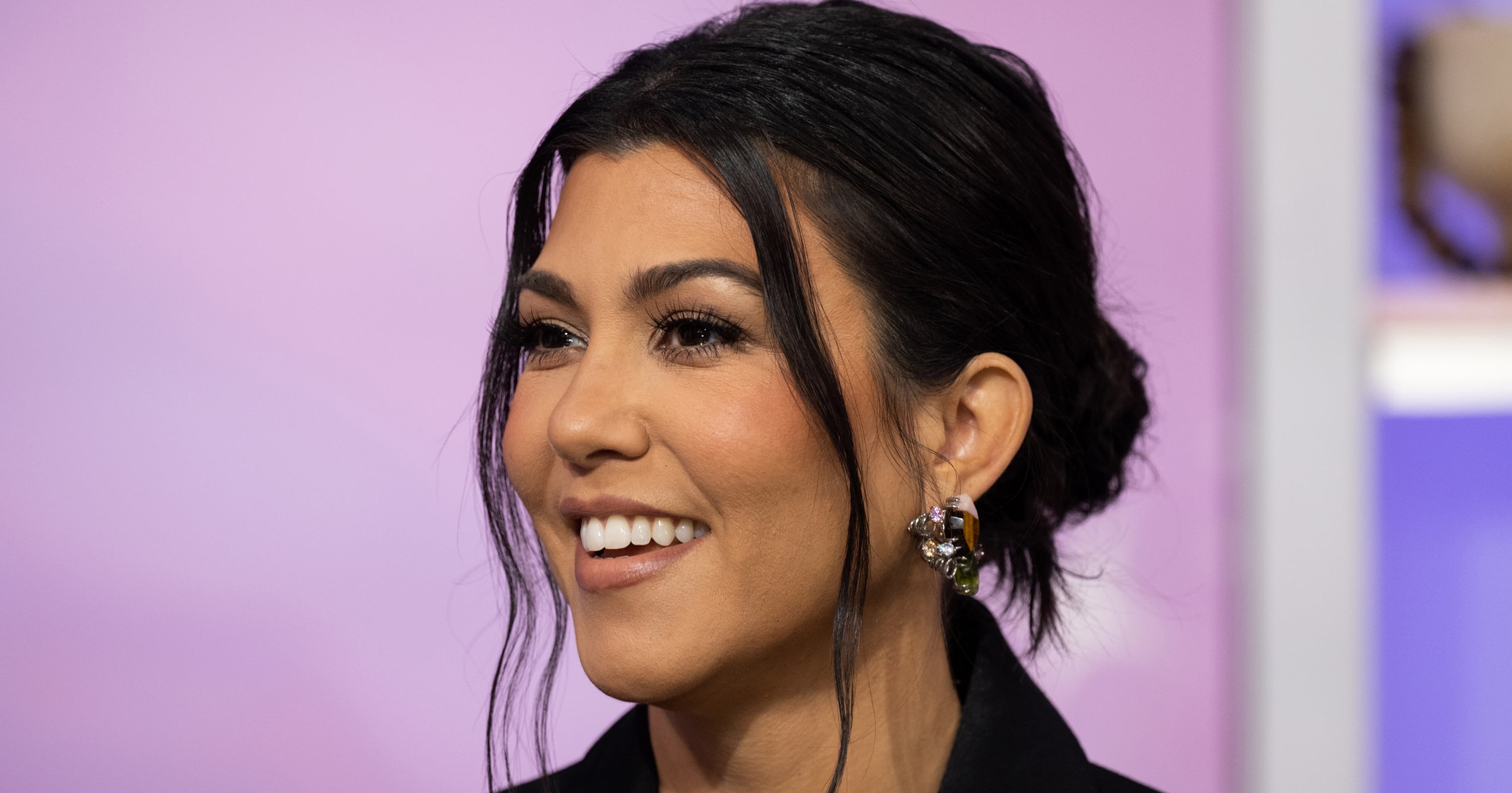 Kourtney Kardashian Cradles Her Baby Bump in a Red String Bikini