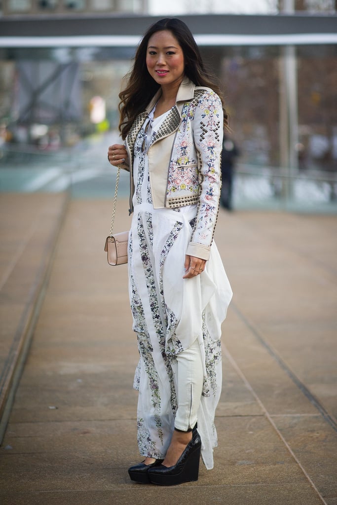 The best thing about a maxi dress in the wintertime is you can pretty much wear anything underneath. Aimee Song chose white leather pants to finish her look.