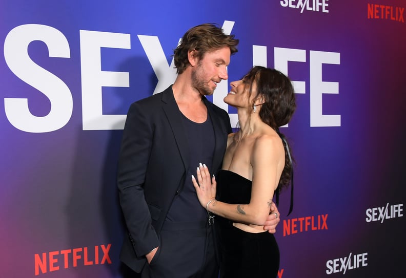 LOS ANGELES, CALIFORNIA - FEBRUARY 23: (L-R) Adam Demos and Sarah Shahi attend Netflix's 