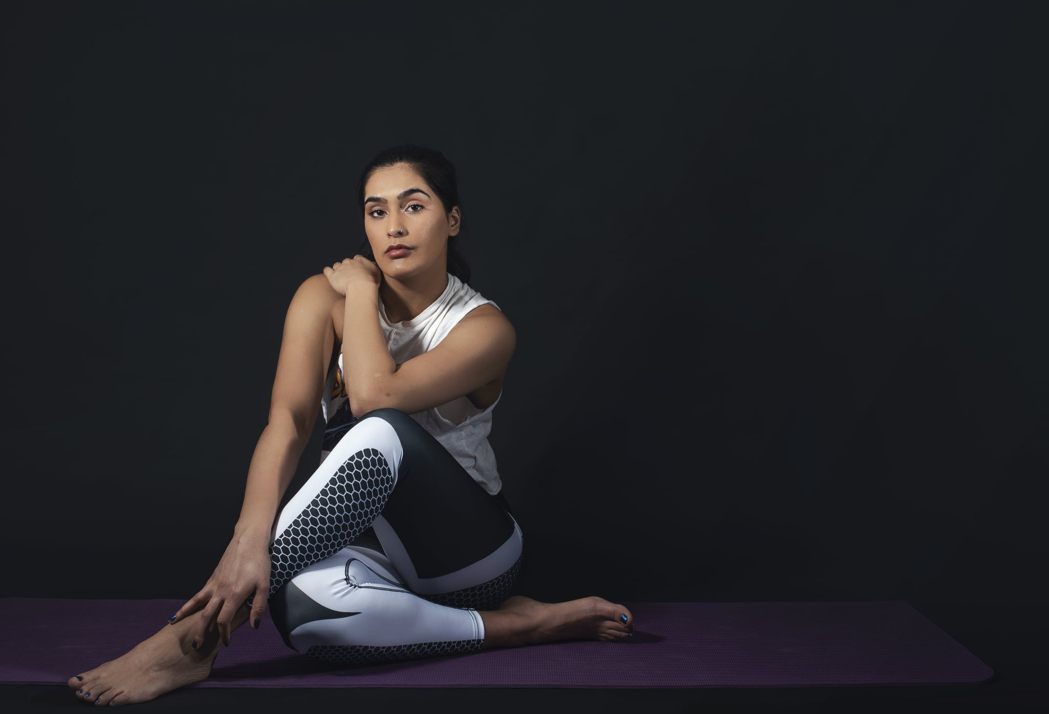 tmp_0VL2hW_924713eef6c3fb8d_woman-sits-in-yoga-pose.jpg