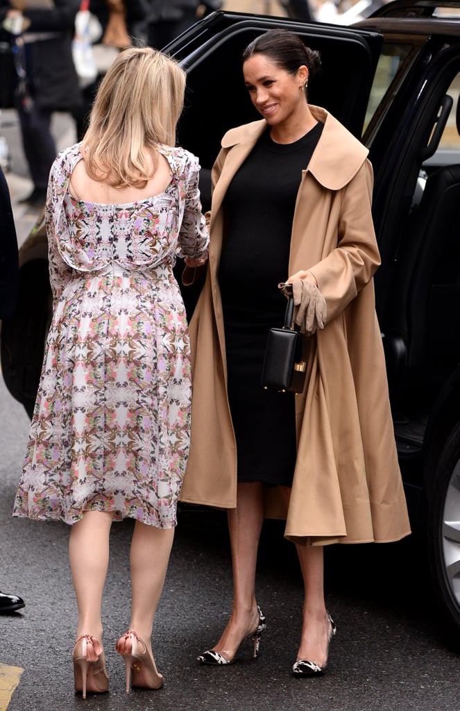 Meghan Markle Fall Outfit Idea: A Black Dress, with a Beige Trench, and Cow Print Heels