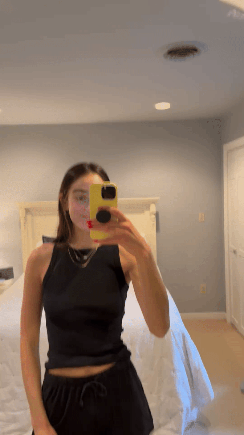 Andi Breitowich high-fiving herself in the mirror.