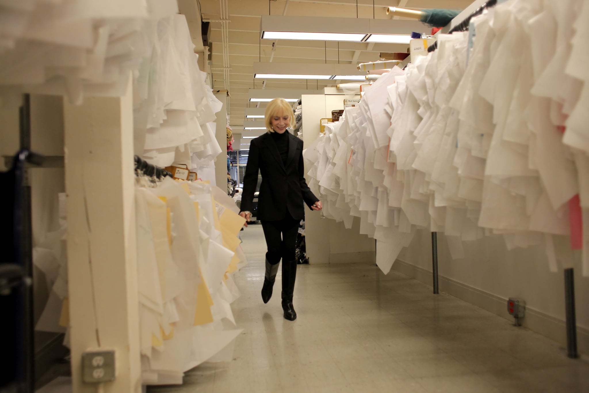 SAN FRANCISCO, CA - JAN. 31: Designer Jessica McClintock walks through the hanging patterns at her headquarters, Monday January 31, 2011, in San Francisco, Calif. She is famed for her Gunne Sax line of prom dresses, which were huge in department stores in the 1980's. McClintock, whose Gunne Sax fashion empire is said to have done $100 million in annual sales at its height, died Feb. 16 at her San Francisco home. She was 90 years old. (Lacy Atkins/The San Francisco Chronicle via Getty Images)