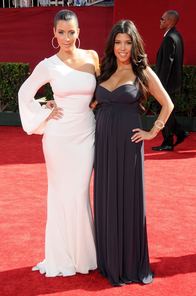 Kim posed with her sister Kourtney at the Emmys in LA in September 2009.