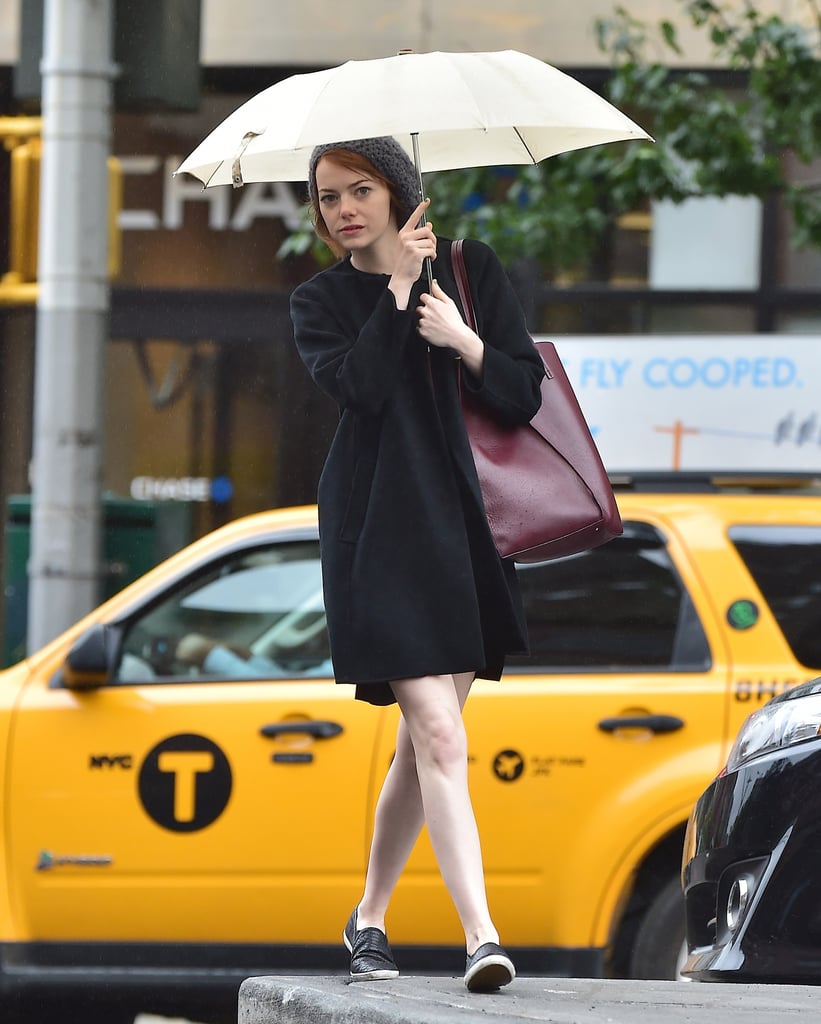 Emma Stone grabbed an umbrella for a Wednesday walk around NYC.