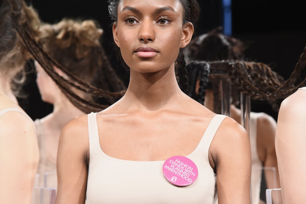 The CFDA distributed pink pins that are also spotted all over Fashion Week, on models and showgoers alike.