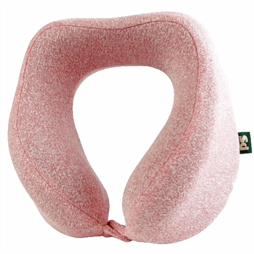 Popsugar Travel Neck Pillow ($20)
Our editors are obsessed with the Popsugar memory foam neck pillow, which has an ergonomic design and is made of a soft mlange knit. Whether you travel by plane, train, or car, it's supportive and comfortable for long trips. Not to mention, the colors it comes in — soft pink, salmon, jade aura, and blue glaze — offer our signature pop of color that makes things fun. The built-in snap ensures it stays in place or attaches to your suitcase handle for when you're on the go. Even better? You can toss the cover in the wash when you get home.