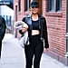 Chrissy Teigen Wearing Leggings and a Leather Jacket