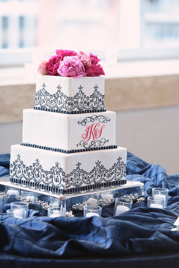 The whimsical black trim, the pink peonies, the personalized initials — so much about this cake screams "romantic." 
Photo by Kristin Vining Photography via Style Me Pretty