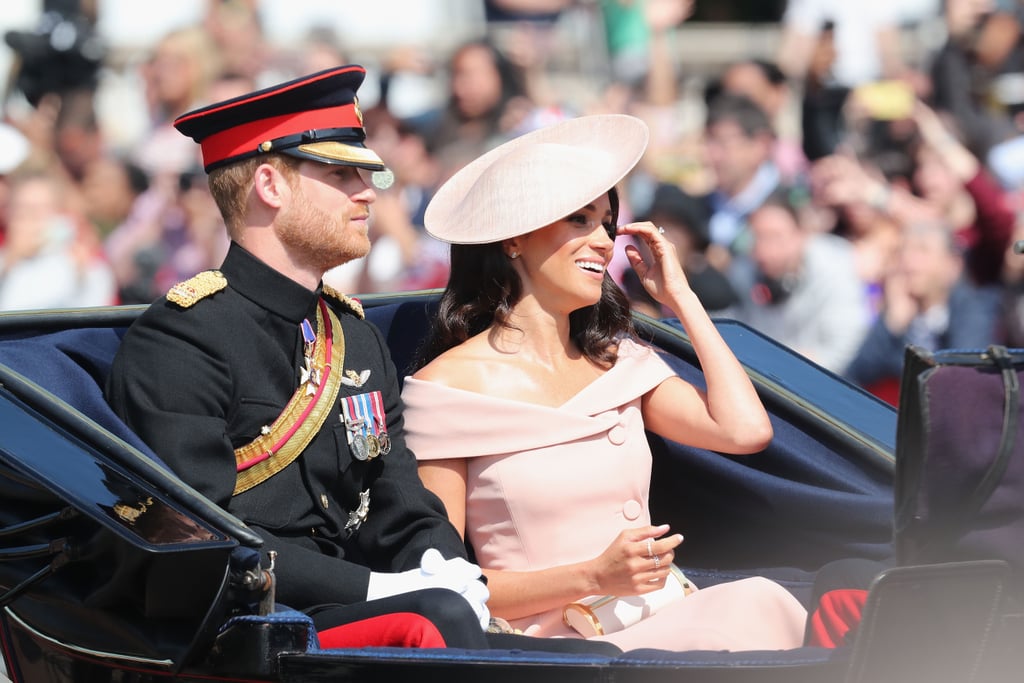 For her first Trooping the Colour, Meghan stunned in a pink off-the-shoulder dress by Carolina Herrera, which she accessorized with a matching Philip Treacy hat and a clutch.