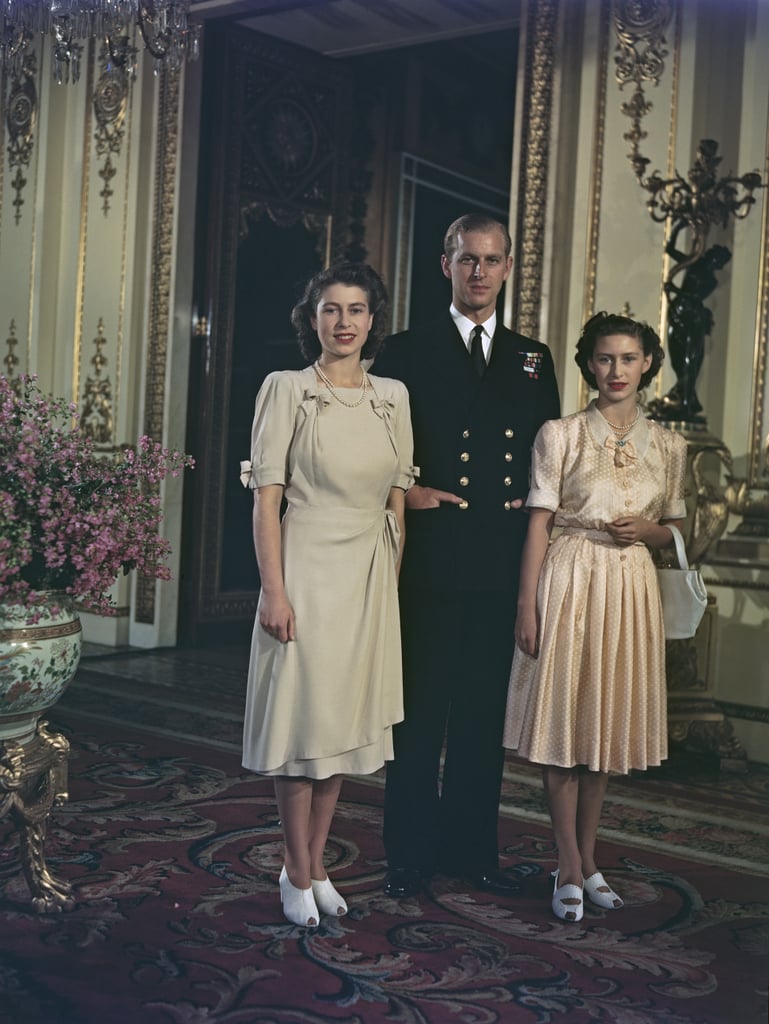 Margaret (somewhat begrudgingly) posed with her sister Elizabeth and her new fiancé, Prince Philip, after their engagement announcement in 1947.