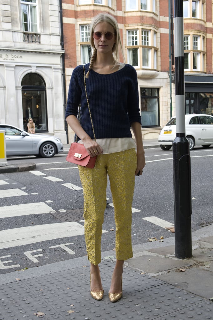 Poppy Delevingne styled up an understated play on embroidered trousers and metallic heels, adding in a classic knit topper.
Poppy Delevingne styled up an understated play on embroidered trousers and metallic heels, adding in a classic knit topper.