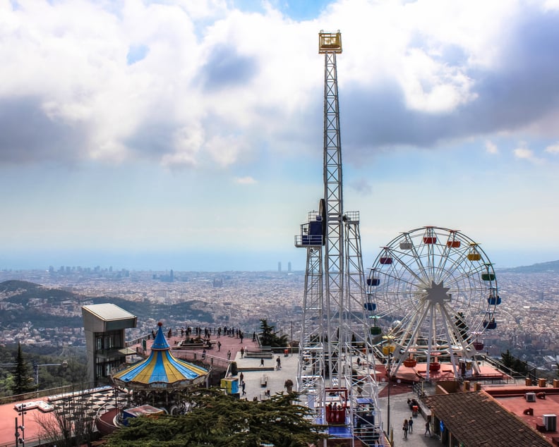 Enjoy thrilling rides overlooking the city atop Tibidabo Mountain.