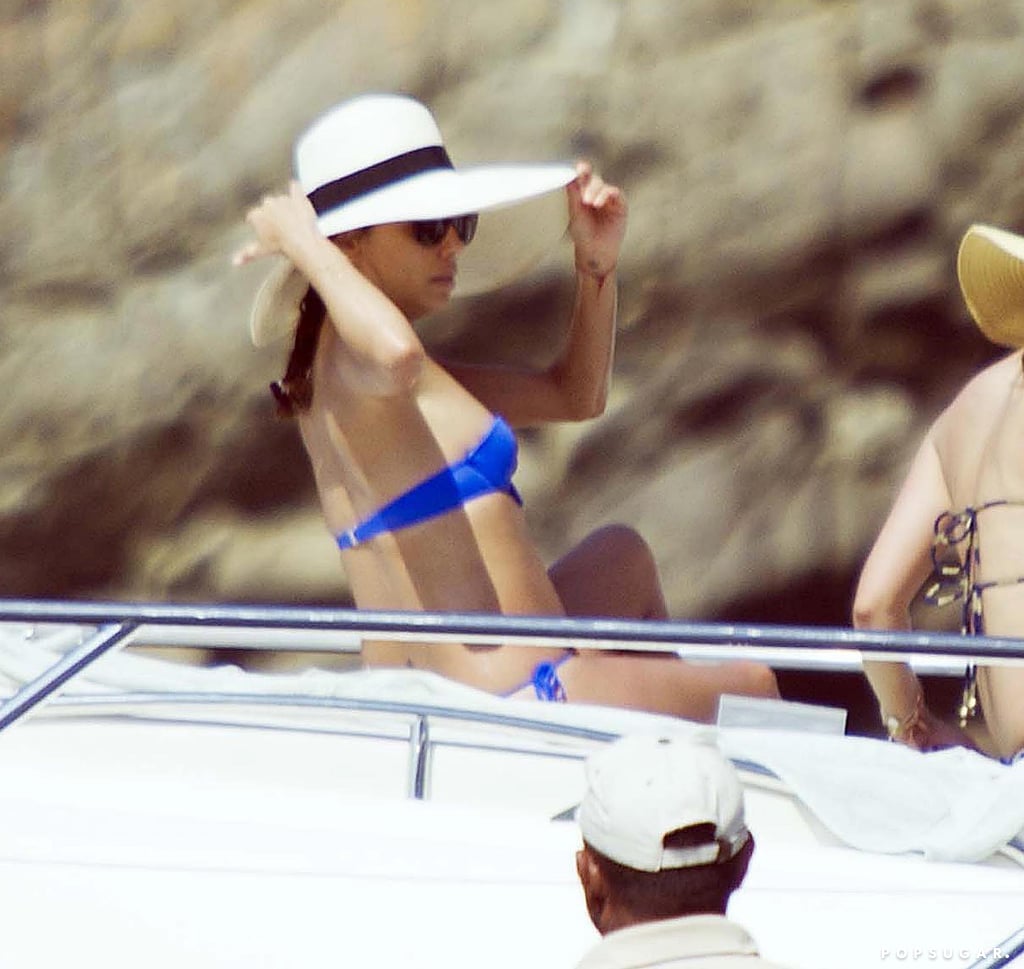 She shaded her face from the sun while lounging on a friend's yacht.