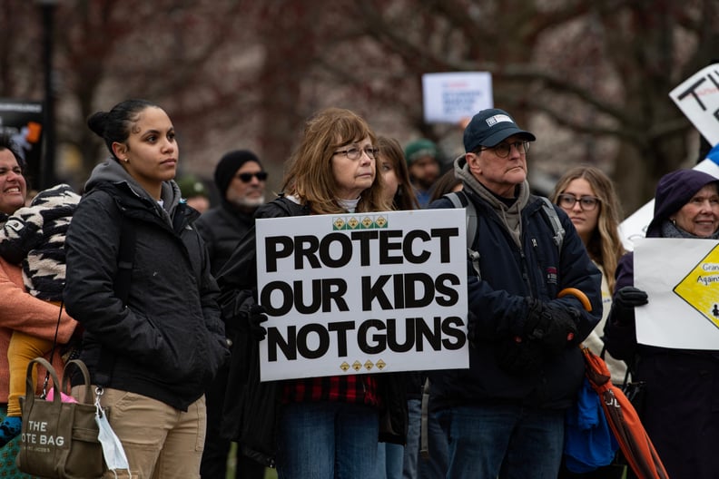 Demonstrators hold signs during an anti-gun violence rally in Boston, Massachusetts, on March 25, 2023. - The rally was organized by the Stand For A Safer Tomorrow, a student led gun violence prevention and awareness organization. (Photo by Joseph Prezios