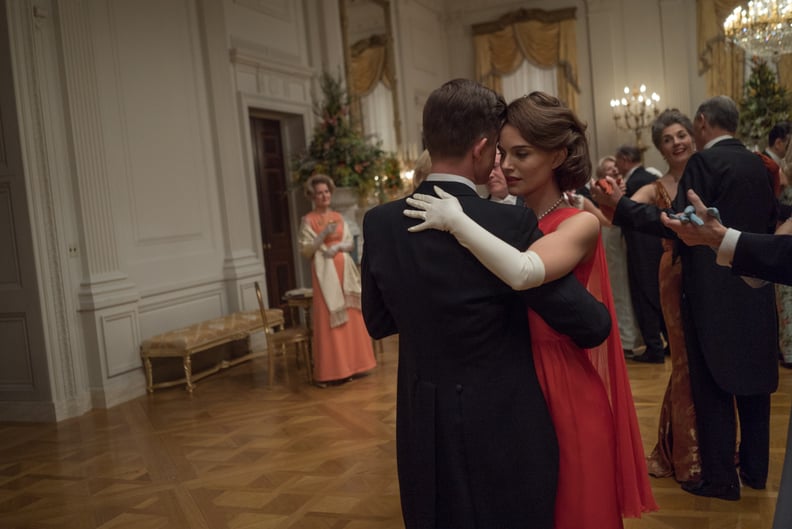 Natalie Wearing a Red Cape Dress and Gloves