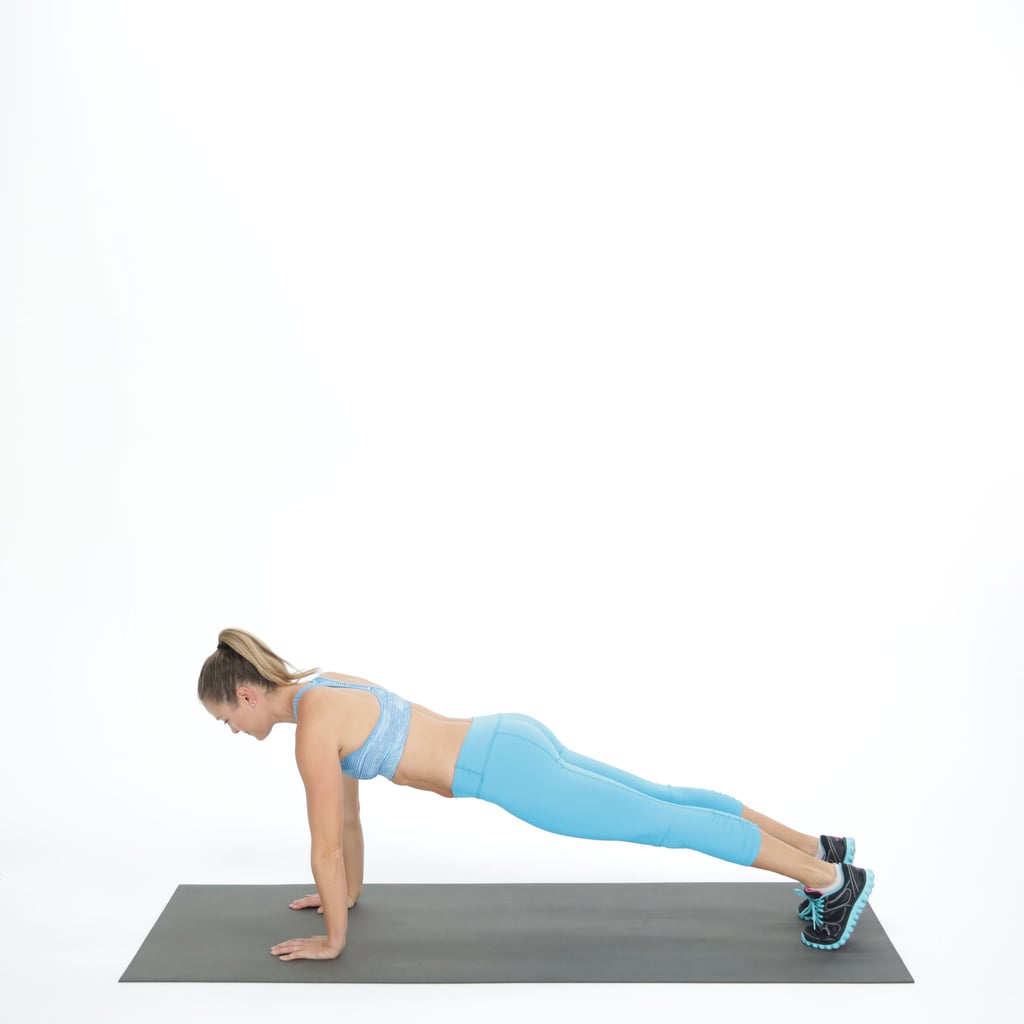 Step your left leg back, coming into a plank position with straight arms and legs. 
