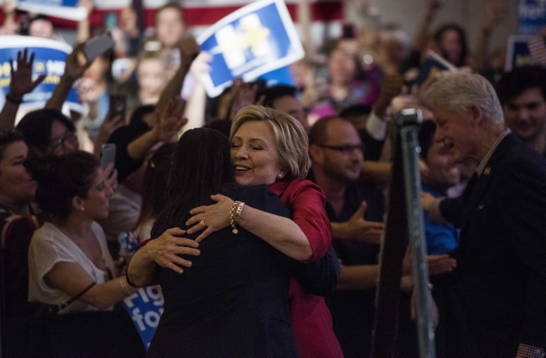LAS VEGAS, NV - Former Secretary of State Hillary Clinton hugs Emmy Ruiz, Nevada State Director, as she approaches the stage to deliver a victory speech to a packed room of supporters after winning the Democratic Nevada Caucus, at Caesars Palace in Las Ve