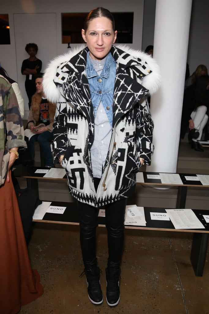 Our favorite part of this fashion week look? The way she's thrown a denim jacket, buttoned just at the top, into this layered mix.