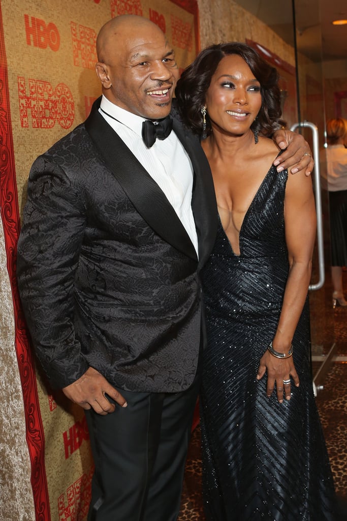 Mike Tyson posed on the carpet with Angela Bassett.