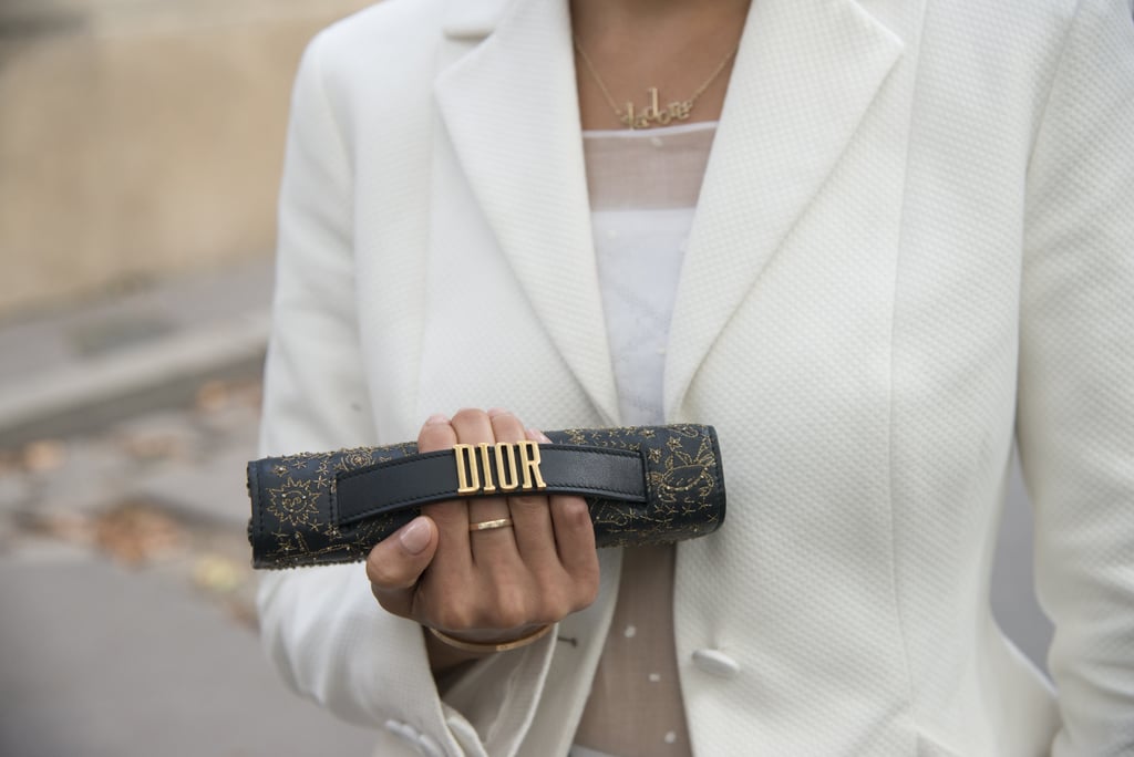 Style Your Statement Making Clutch With a Sleek Gold Ring