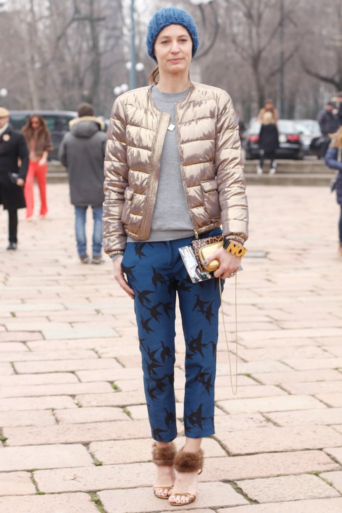 We can't take our eyes off of her metallic puffer or furry-trimmed ankle-straps.
We can't take our eyes off of her metallic puffer or furry-trimmed ankle-straps.