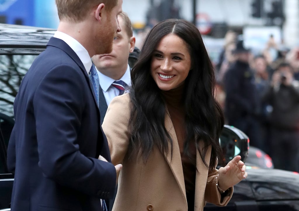 Meghan Markle Looking at Prince Harry Pictures