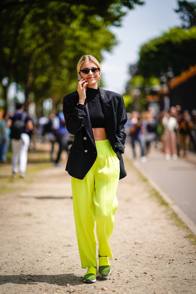 Fearless fashion-forward dressing looks like this: a pair of citron-hued high-waist pants meant to stand out.