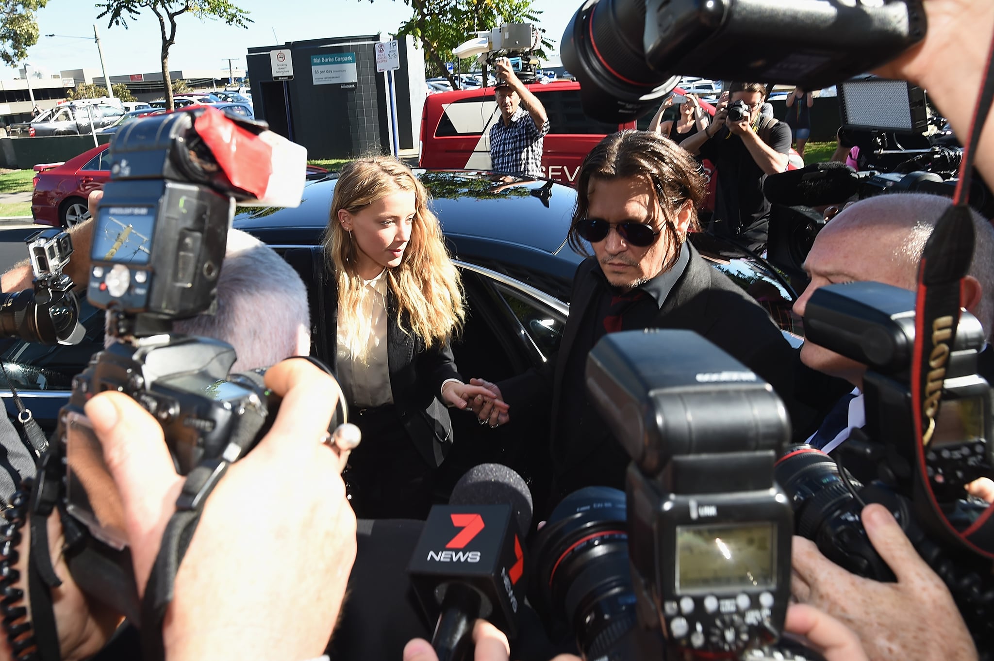 GOLD COAST, AUSTRALIA - APRIL 18:  Johnny Depp and Amber Heard arrives at Southport Magistrates Court on April 18, 2016 in Gold Coast, Australia. Heard is facing two counts of breaching Australia's quarantine laws by allegedly bringing in her pet dogs Pistol and Boo on a private jet in May 2015.  (Photo by Matt Roberts/Getty Images)