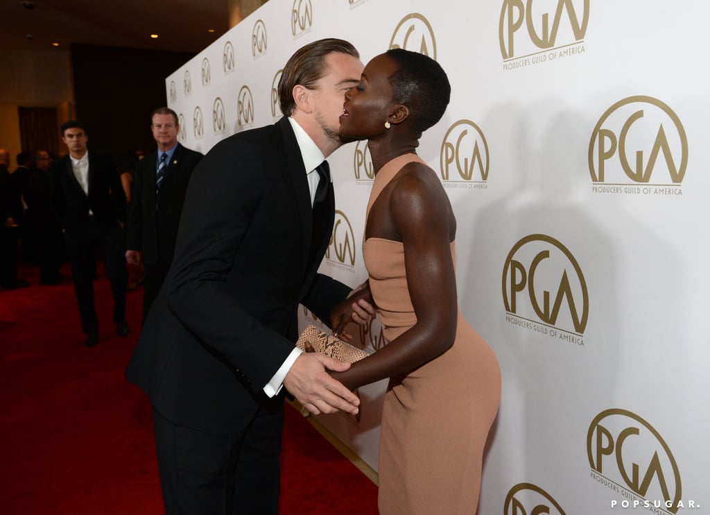 Leonardo DiCaprio kissed Lupita Nyong'o on the red carpet at the Producers Guild Awards.