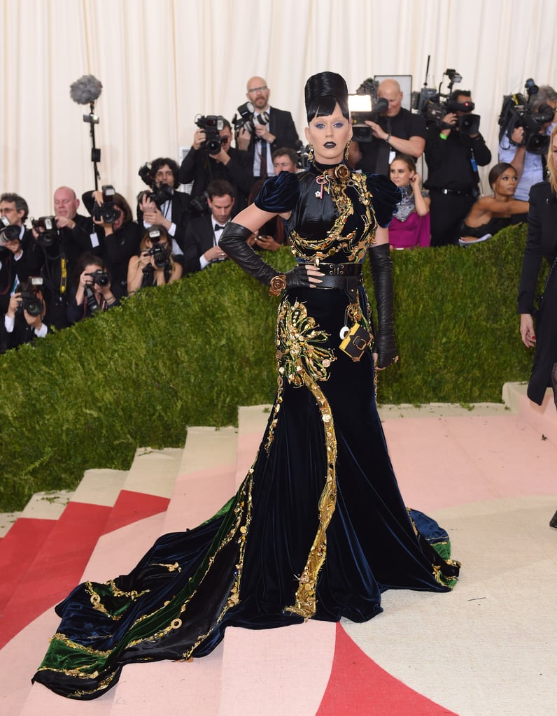 The theme for the 2016 Met Gala was Manus x Machina: Fashion in an Age of Technology. Katy wore a midnight blue velvet Prada gown with gold trim and long gloves.
