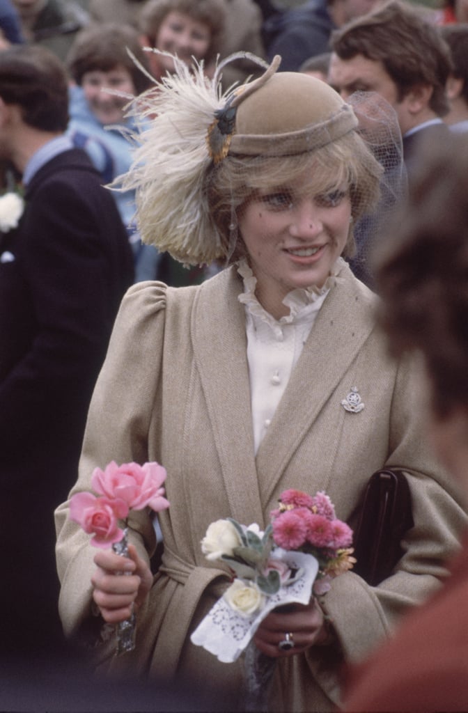 Just after getting married, Diana chose a neutral palette for her Caroline Charles coat and the plumes on her John Boyd hat, for a trip to Wales.